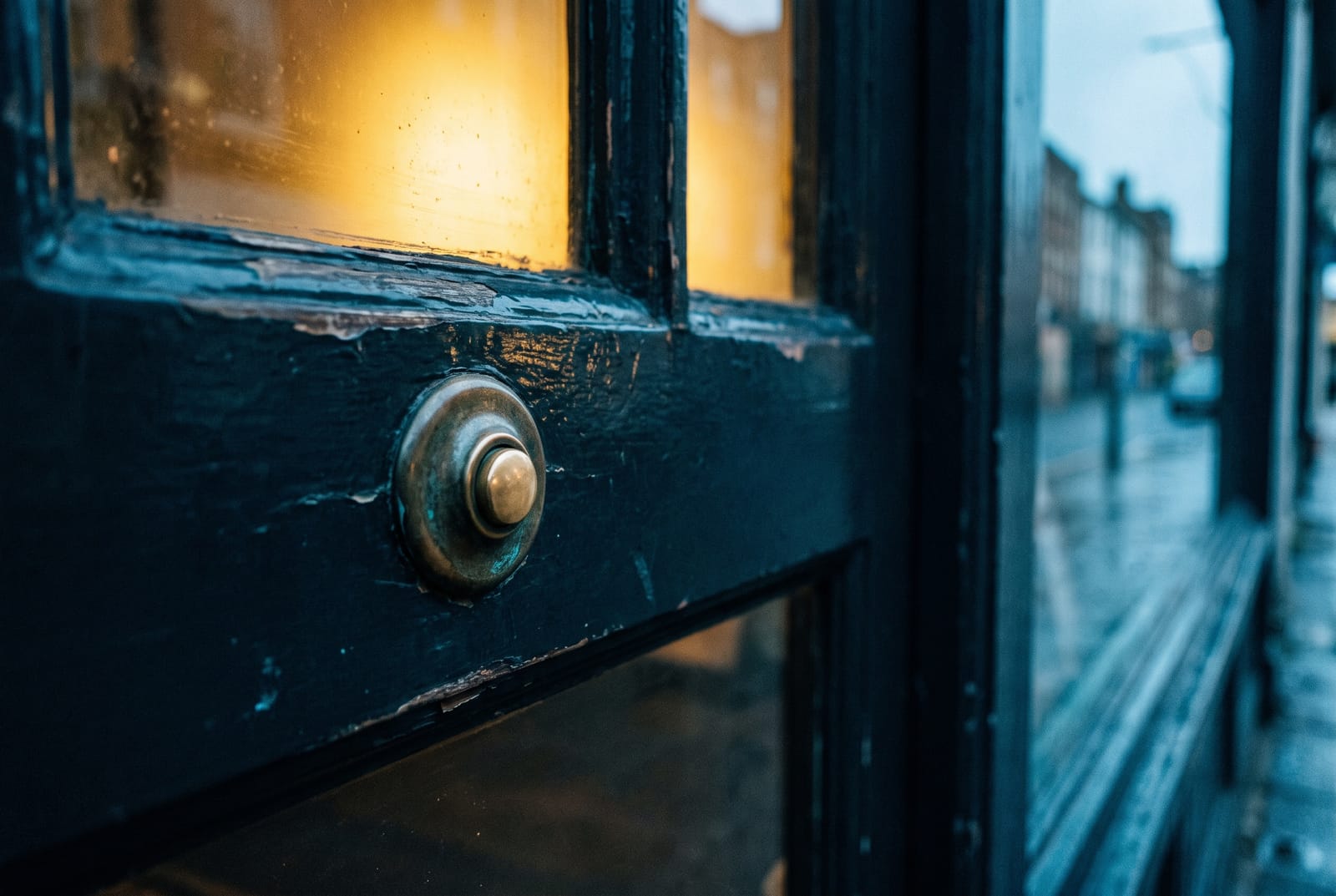 A push-to-exit button mounted beside an office egress door, with a magnetic lock visible at the head of the frame